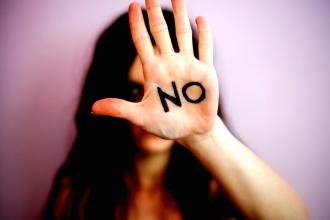 
		Against domestic violence: A woman has "no" written on her hand
	